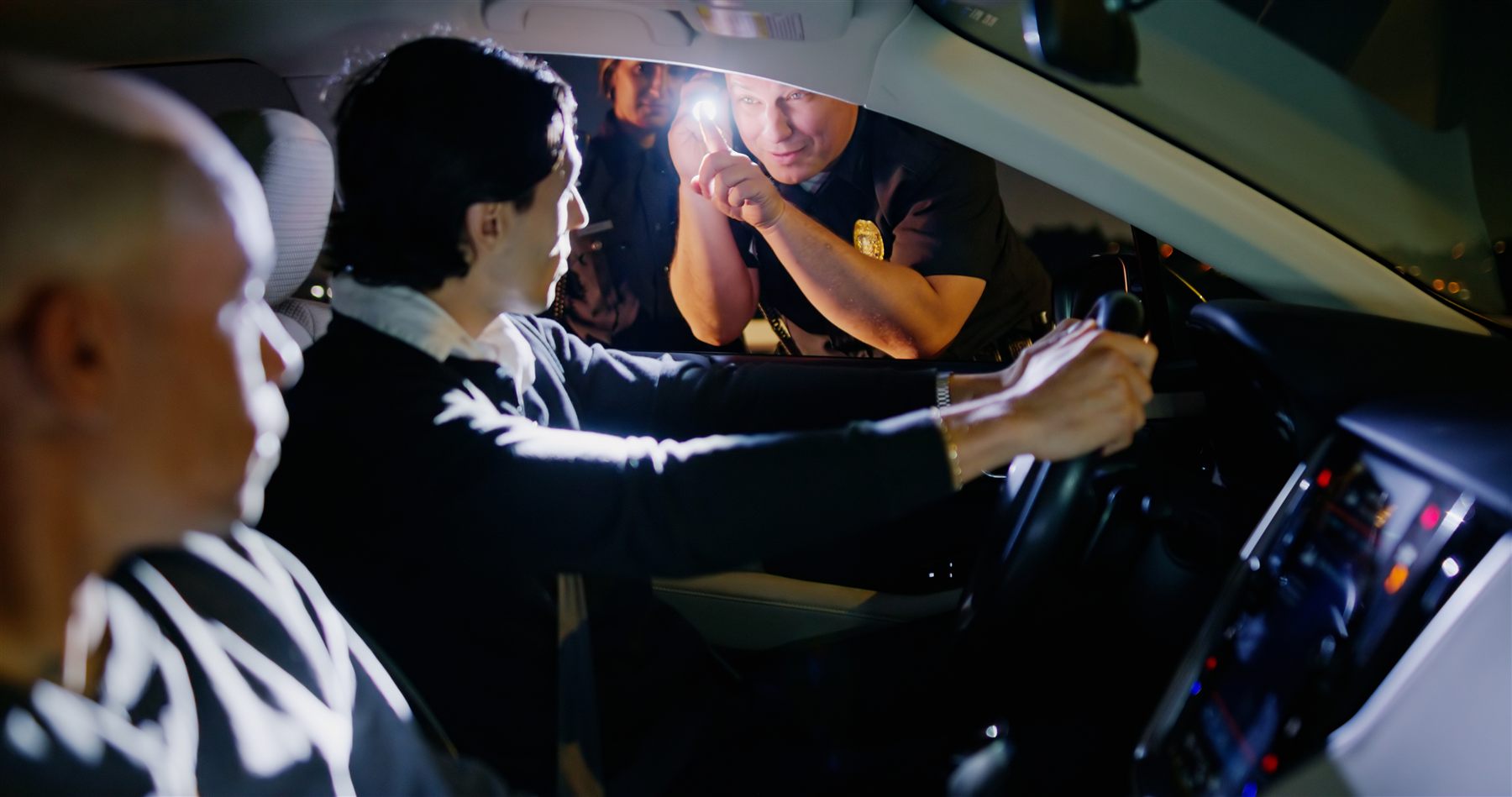 Officer and driver interaction viewed from inside a vehicle for public defender BAC review